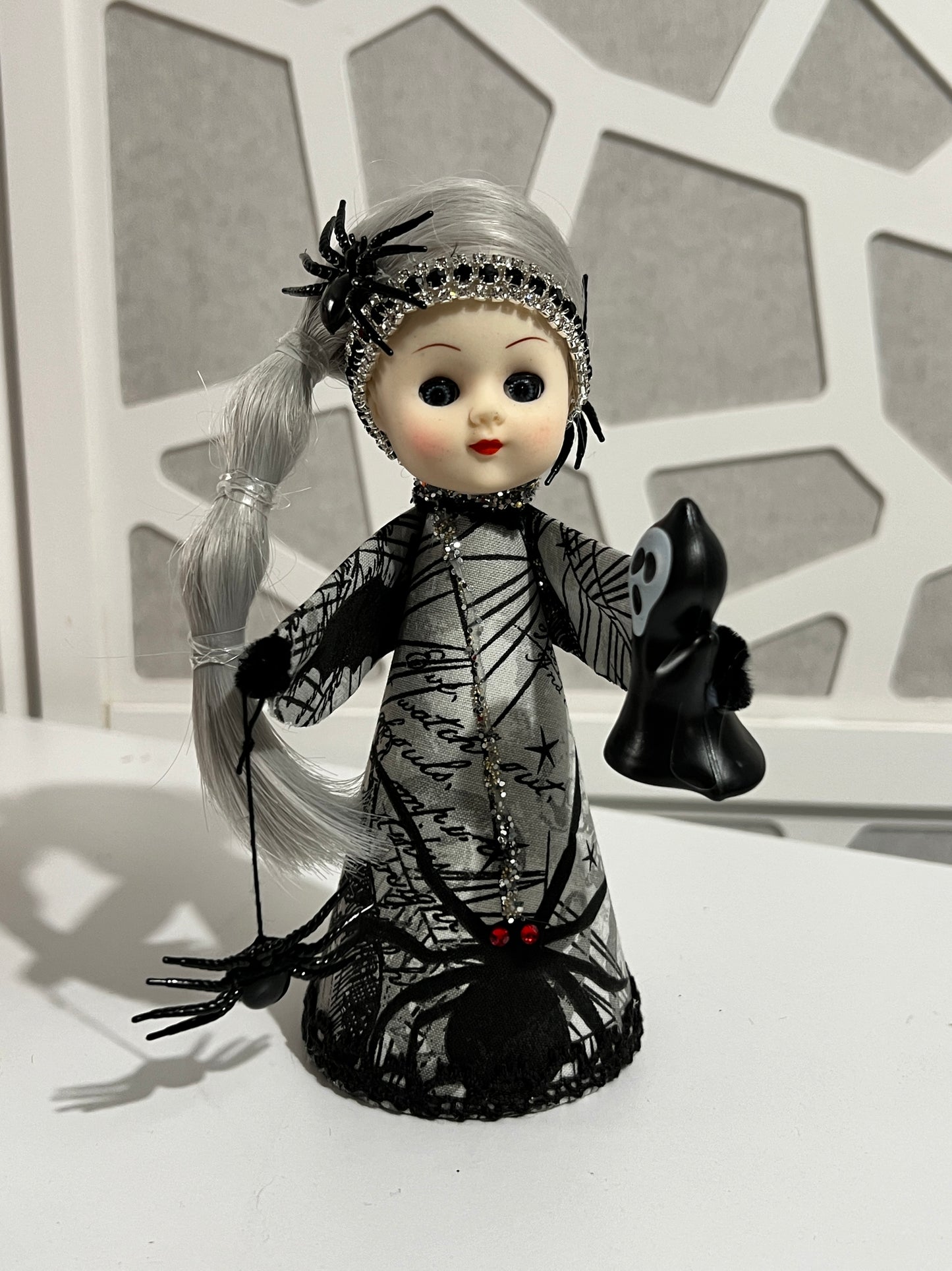 Vintage Spider Princess doll on white tabletop