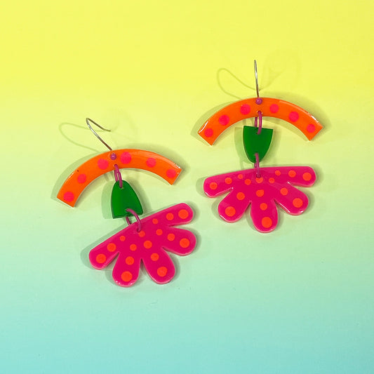 Psychedelic colored dotted flower earrings on sterling earwires.