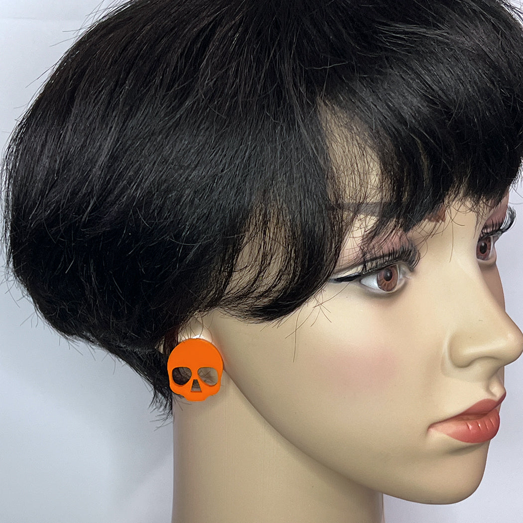 Bright orange acrylic skull post earrings from by Barbe Jewelry.