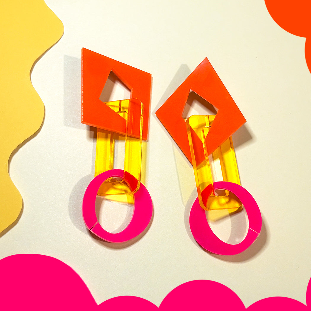 Closeup of vibrant abstract chain link earrings from Audacious Studio.