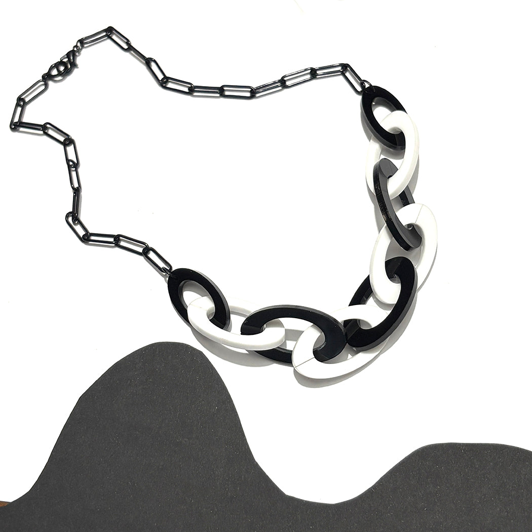 Black and white chain necklace on a white background