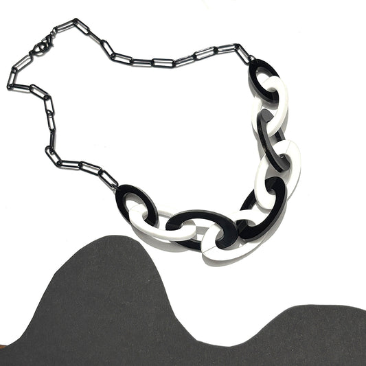 Black and white chain necklace on a white background