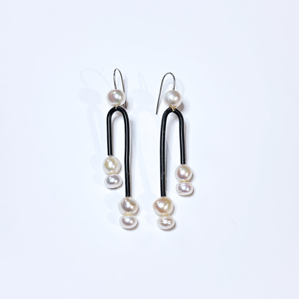 Close up of Post Modern Pearl earrings 
