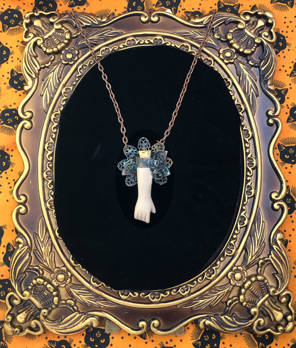 Floral Doll Arm Reliquary Pendant