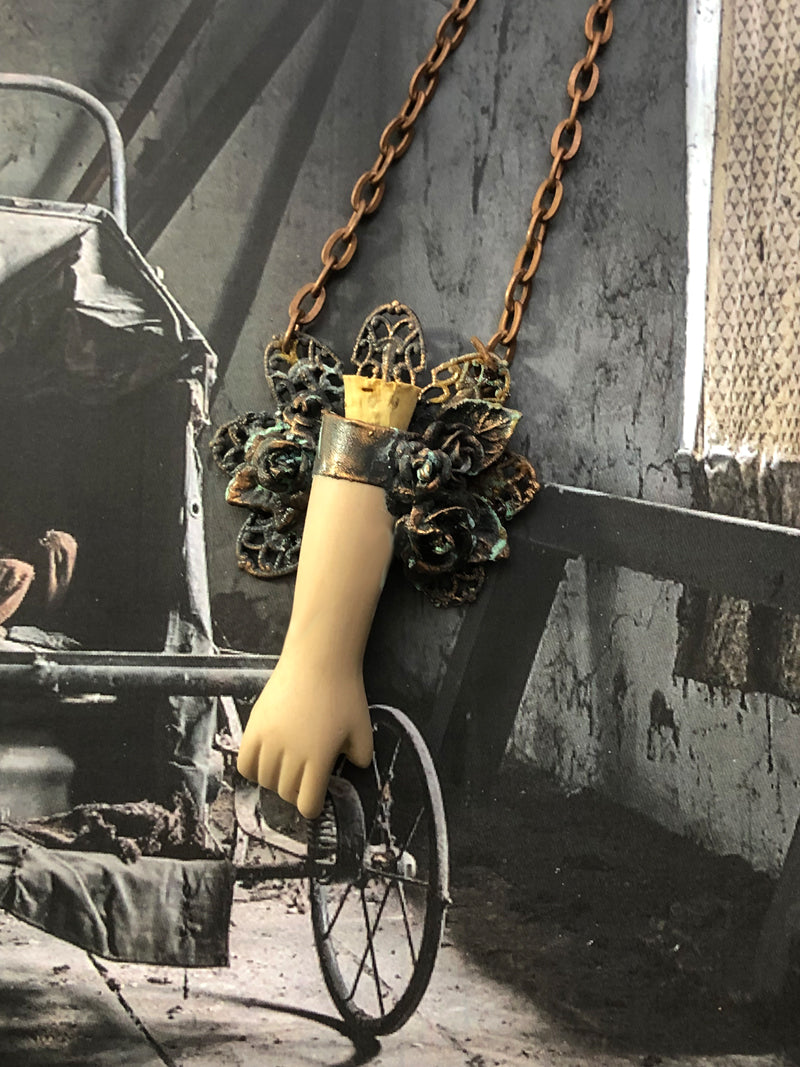 Floral Doll Arm Reliquary Pendant