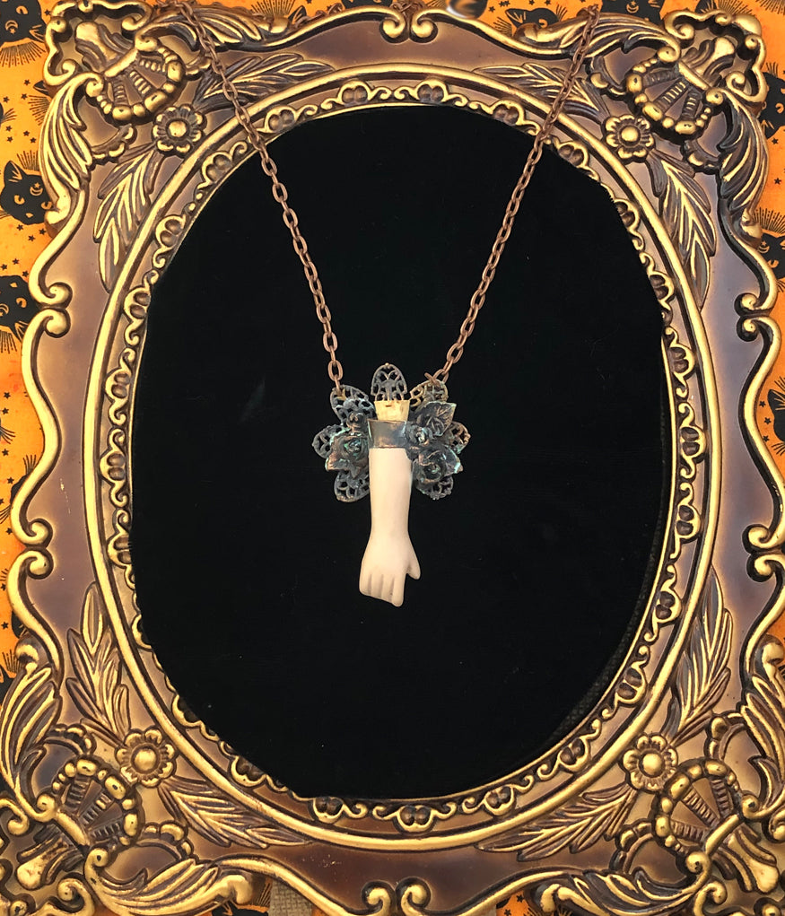 Floral Doll Arm Reliquary Pendant