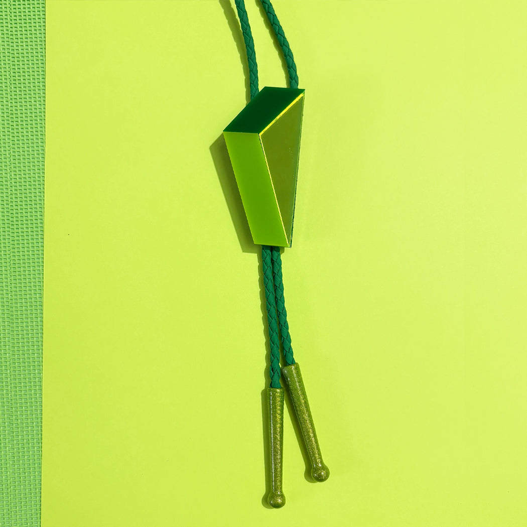Geometric green bolo tie with green cord and green tips.