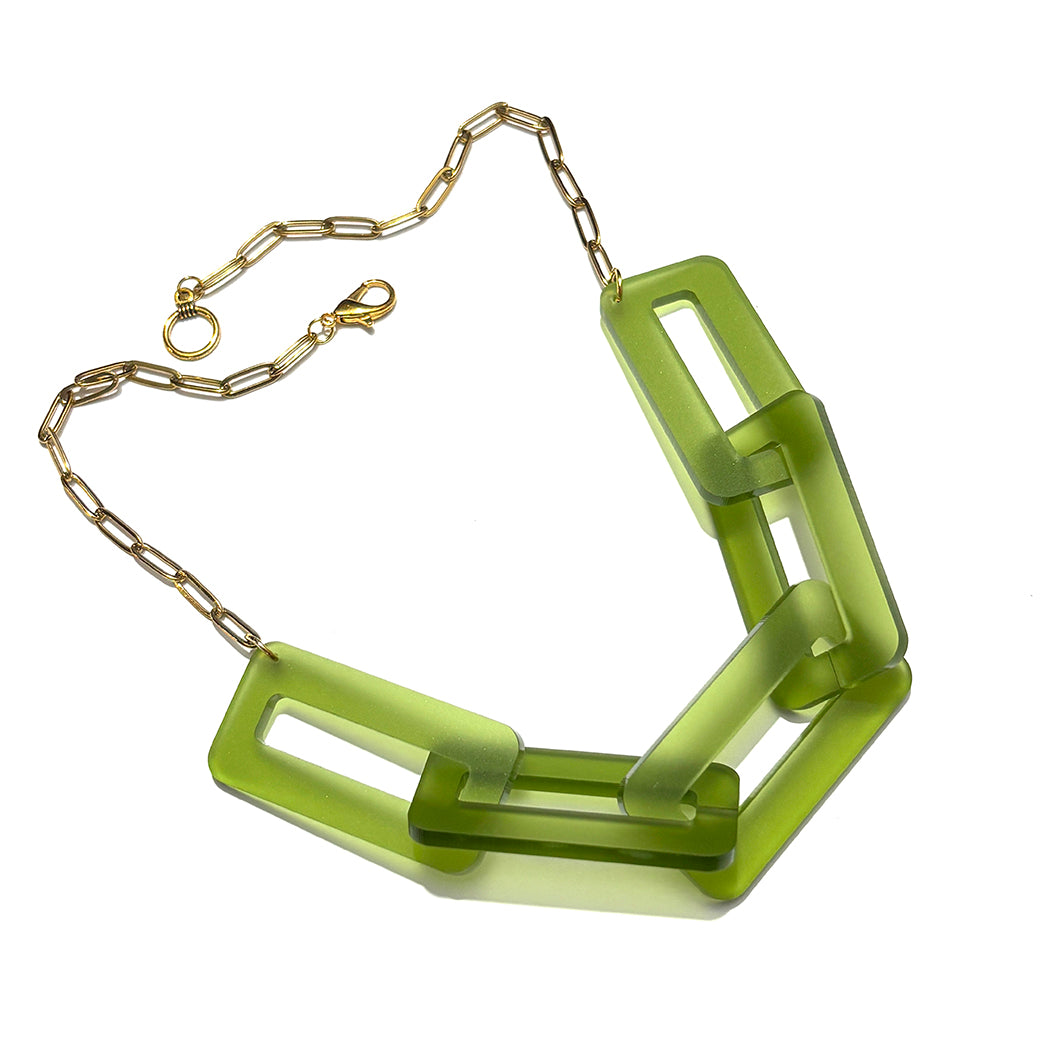 Green chain necklace on a white background