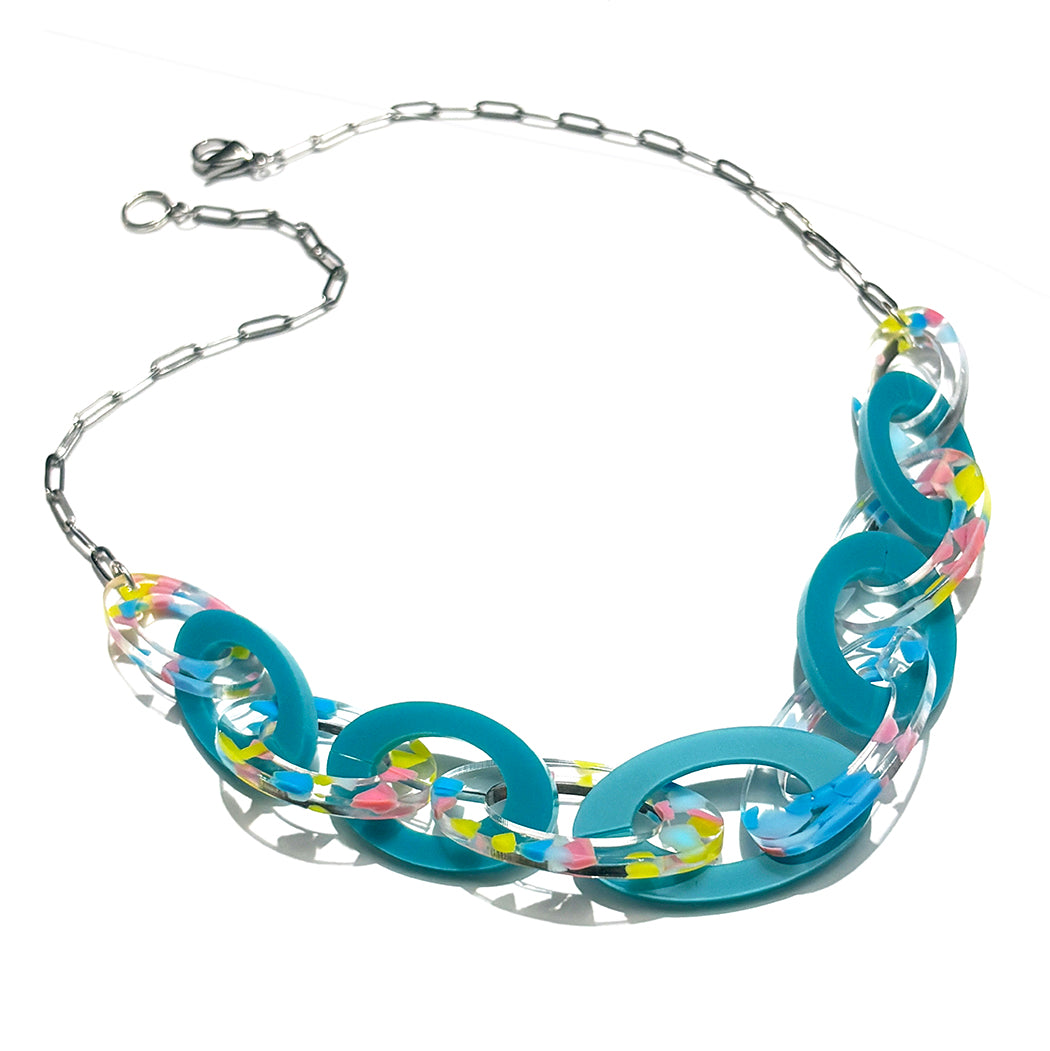 Necklace with blue and clear links on a white background
