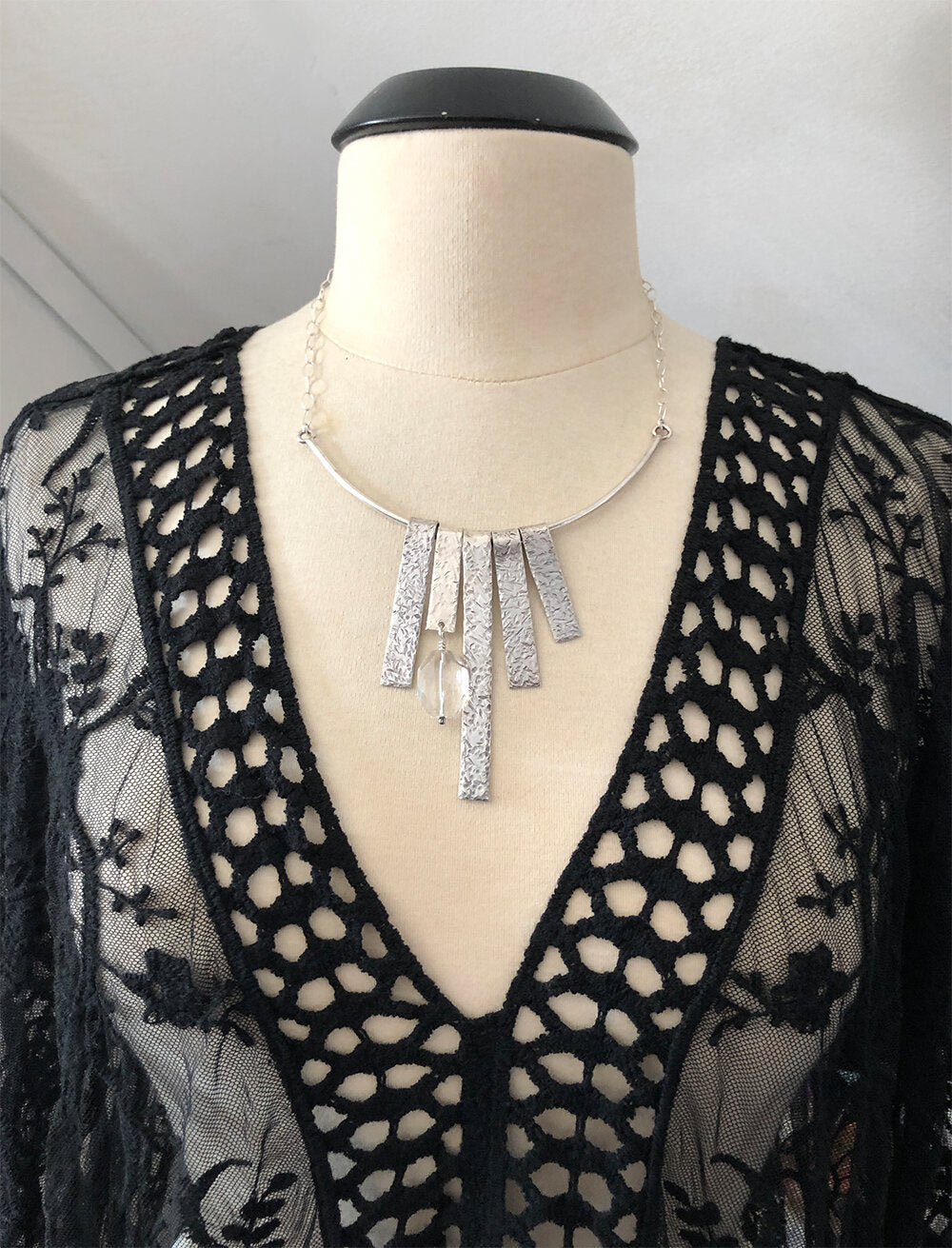 Sterling statement midcentury style fringe necklace on dress form with sheer black negligee.
